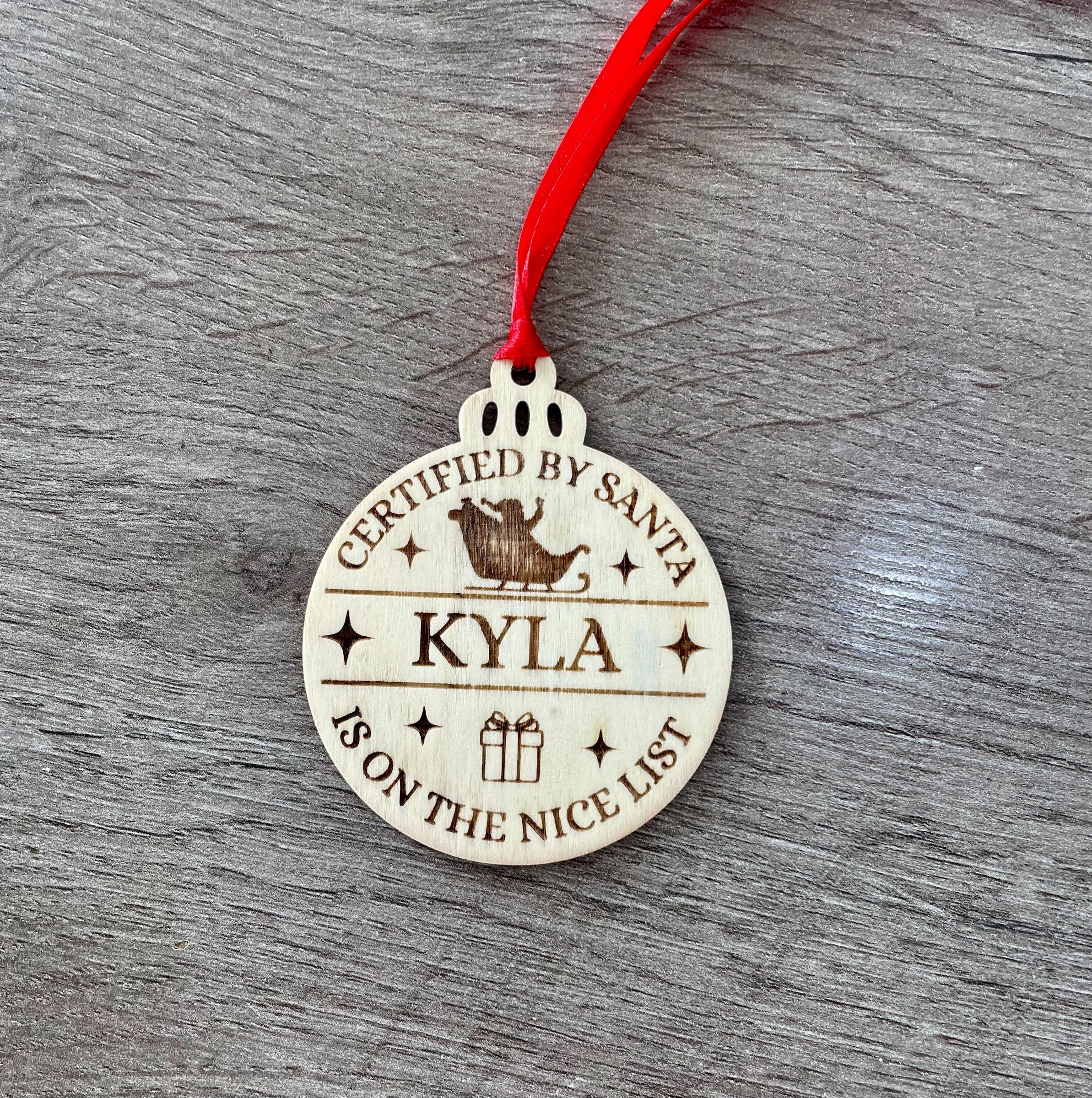 Personalised Santa's Nice List Bauble: Engraved Wood Christmas decoration